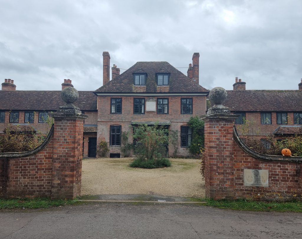 The front of Farley Hospital. A red brick building with tile roof